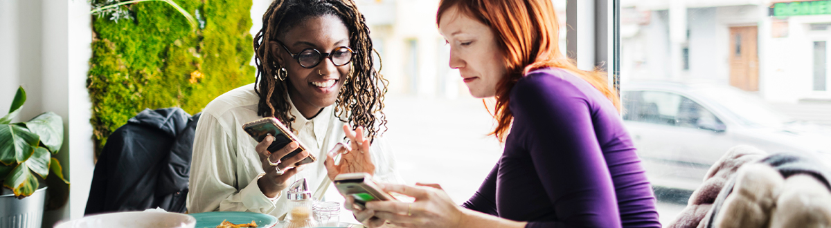Two women consuming media on their mobile devices which Ethical Research Solution's study design and sampling tools help measure.