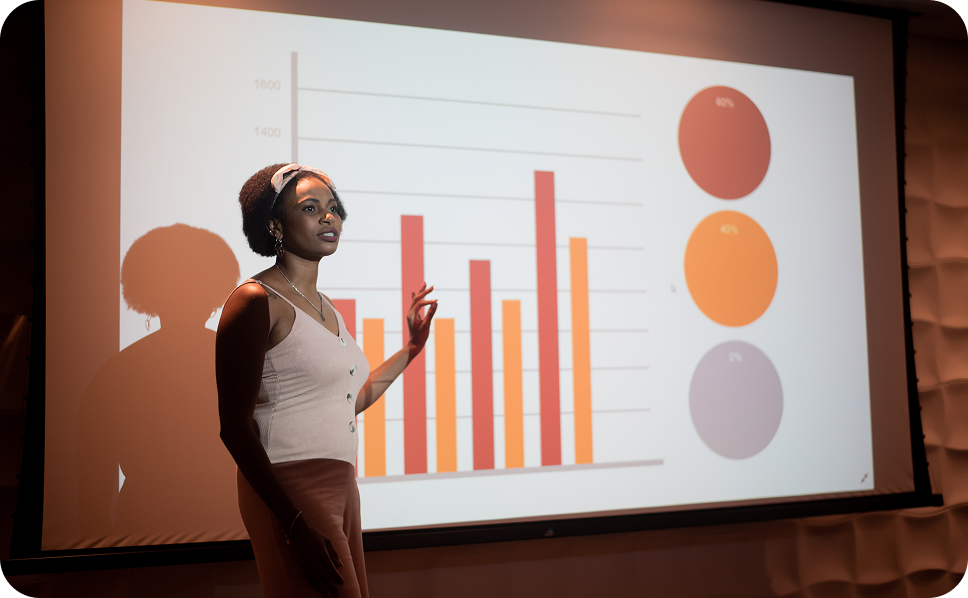 A woman presenting a graph featuring ERS's scarborough data.