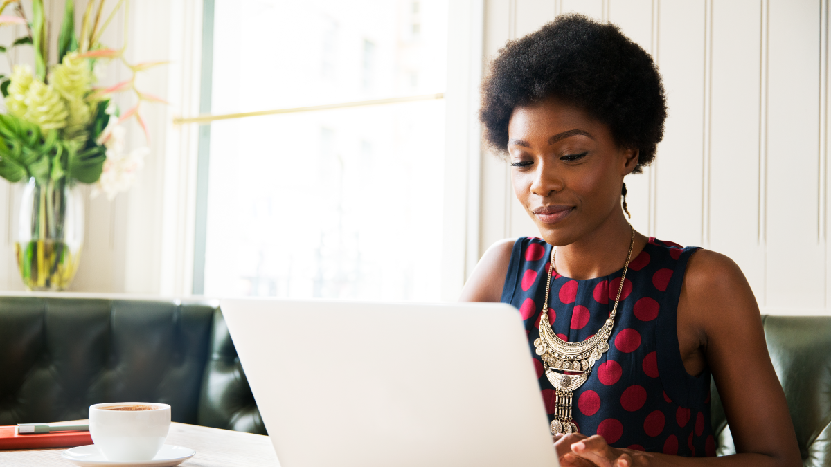 Marketer on her laptop discovering individual-level granularity data with ERS's tv field and survey research solution.